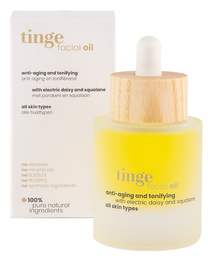 tinge facial oil bottle and packaging on a white background