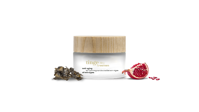 tinge anti aging daycream for women tinge anti aging daycream for women with pomegranate and brown algae on a white background